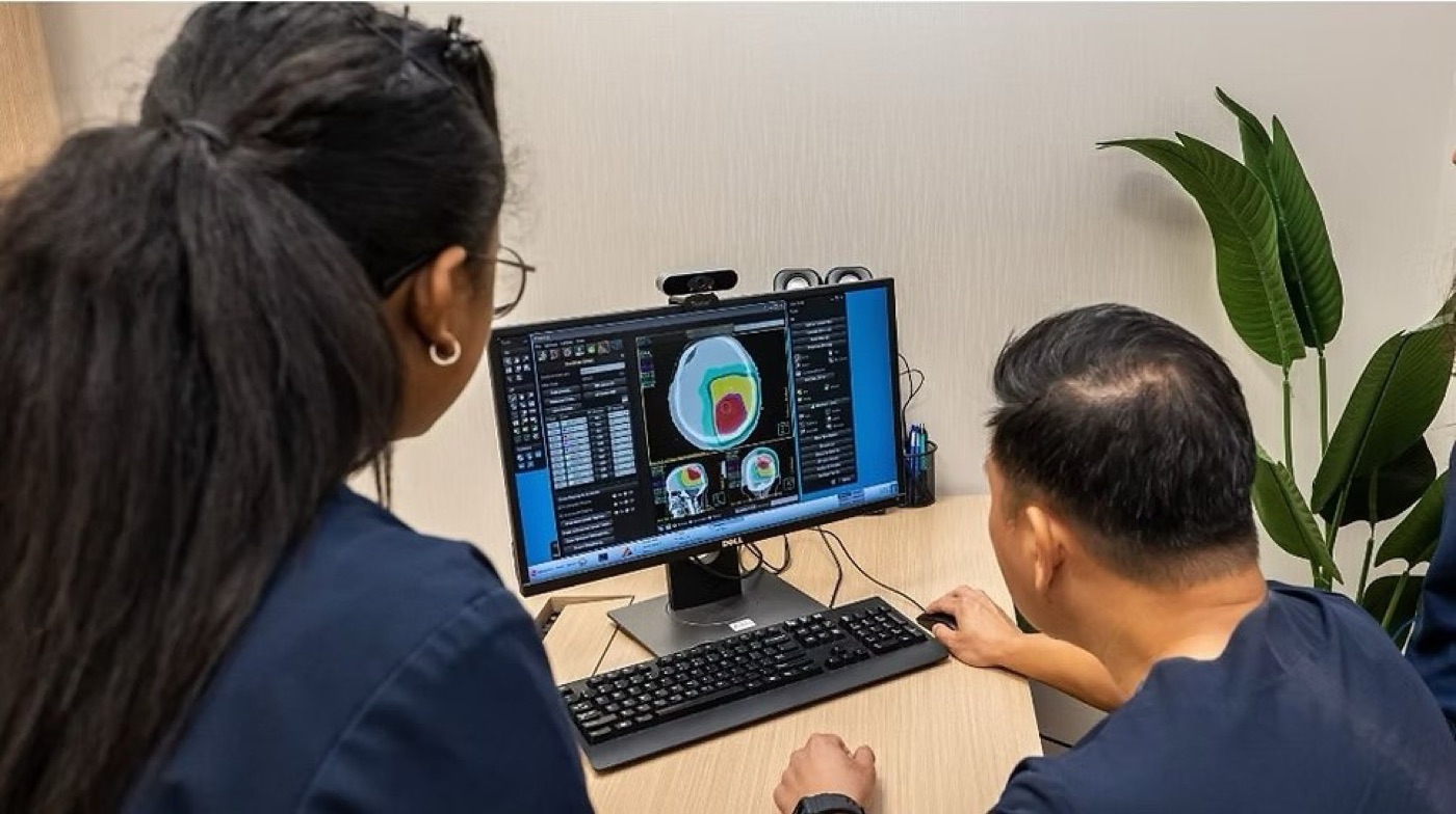 Oncologist contouring the treatment area on diagnostic imaging