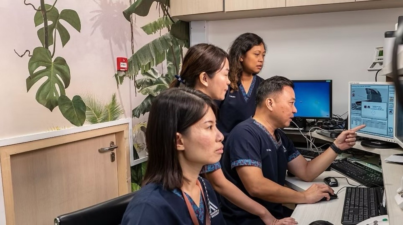 Radiation oncologist and medical physicist reviewing a treatment plan